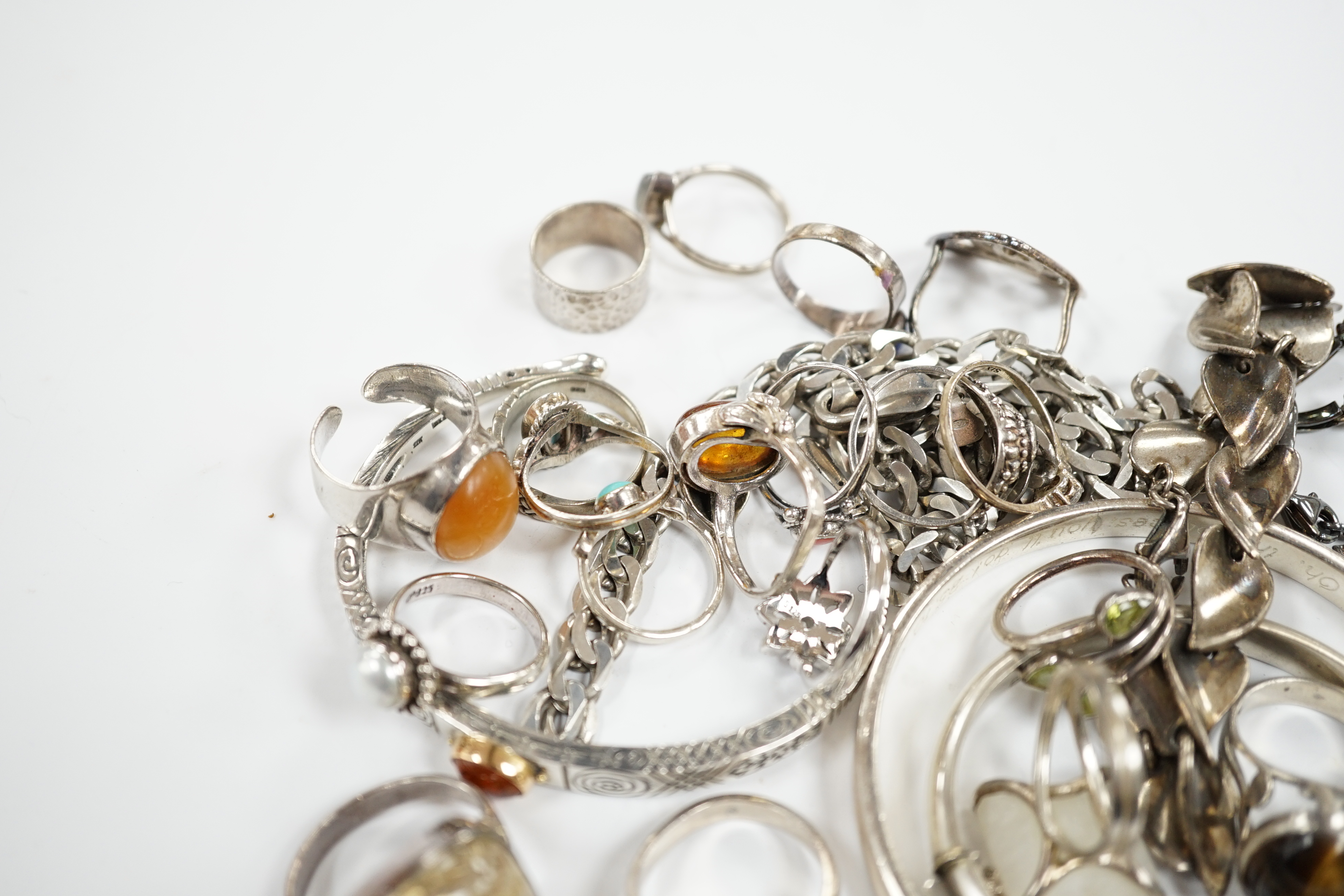 A collection of 925 and white metal rings, bangles and necklaces.